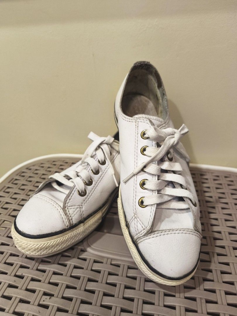 Converse All Star Low White Leather Sneakers (Category: Sneakers) located in Baguio. Submitted by zia_zab (Listing ID 1468529568, Image 1). Description: - White leather Converse All Star low top sneakers - Features classic brass eyelets, white laces, and rubber toe caps - Pre-loved condition with noticeable scuffs, dirty soles, and inner lining wear - Plenty of life left for everyday casual outfits - Fits true to standard sizing Size 5 womens, 23