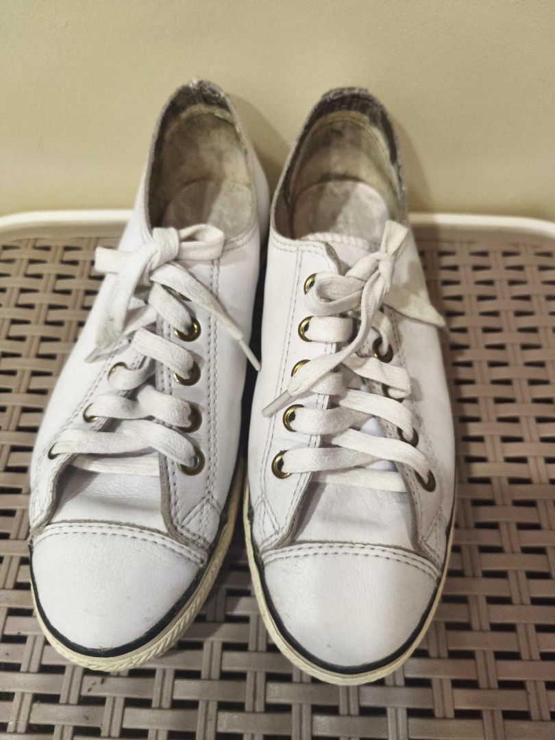 Converse All Star Low White Leather Sneakers (Category: Sneakers) located in Baguio. Submitted by zia_zab (Listing ID 1468529568, Image 2). Description: - White leather Converse All Star low top sneakers - Features classic brass eyelets, white laces, and rubber toe caps - Pre-loved condition with noticeable scuffs, dirty soles, and inner lining wear - Plenty of life left for everyday casual outfits - Fits true to standard sizing Size 5 womens, 23