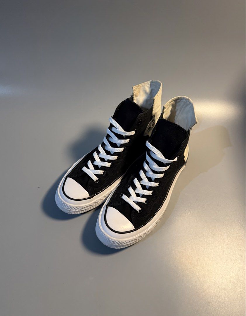 Converse Chuck 70 Hi Black White Split Canvas (Category: Sneakers) located in Quezon City. Submitted by markieexp (Listing ID 1468659998, Image 2). Description: - Style: Black and white canvas high tops with unique split color design and cream heel panels - Details: Classic star ankle patch, white laces, white toe caps, and black vulcanized rubber midsoles with standard heel badges - Size: US Men's 9.5 - Condition: Pre-owned with some dirt and we