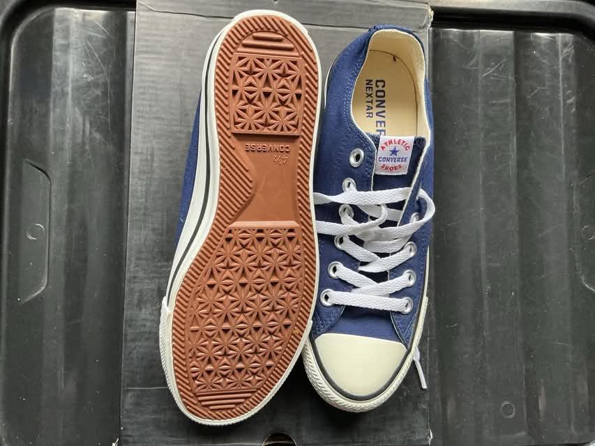 Converse Nextar Blue Low Top Sneakers (Category: Sneakers) located in Quezon City. Submitted by gabrilloaaaaaaa (Listing ID 1468705462, Image 3). Description: Converse Nextar canvas sneakers in blue. White laces and white rubber toe caps. Brown textured rubber outsoles with star patterns. Clean insoles marked Converse Nextar. Classic low top design with contrast stitching along the midsoles. Worn only a couple of times, clean soles and uppers wit