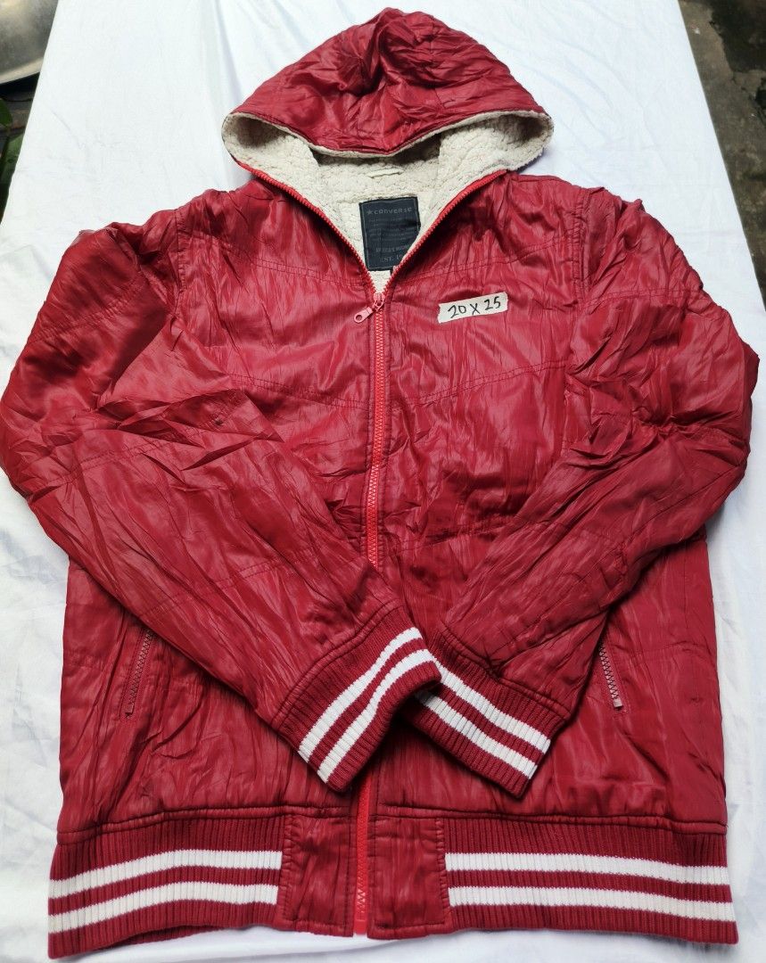 Converse Red Puffer Hooded Jacket Sherpa Lining (Category: Coats, Jackets and Outerwear) located in Caloocan City. Submitted by jerksz (Listing ID 1468584981, Image 1). Description: - Brand: Converse - Color: Bright red - Lining: Soft sherpa inside the hood - Closure: Full front zip - Pockets: Secure side pockets with zippers - Details: Ribbed striped cuffs and bottom hem - Material: Thick, warm padded fabric for cold weather - Size: 20x25 chest 