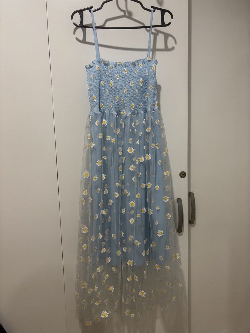 Coquette Baby Blue Daisy Midi Dress (Category: Dresses) located in Quezon City. Submitted by cmtom (Listing ID 1466489332, Image 1). Description: LOC: QC Baby blue smocked dress bought on L app in 2020, never worn. Very dainty and flowy. Can fit S-M No flaws, good condition.