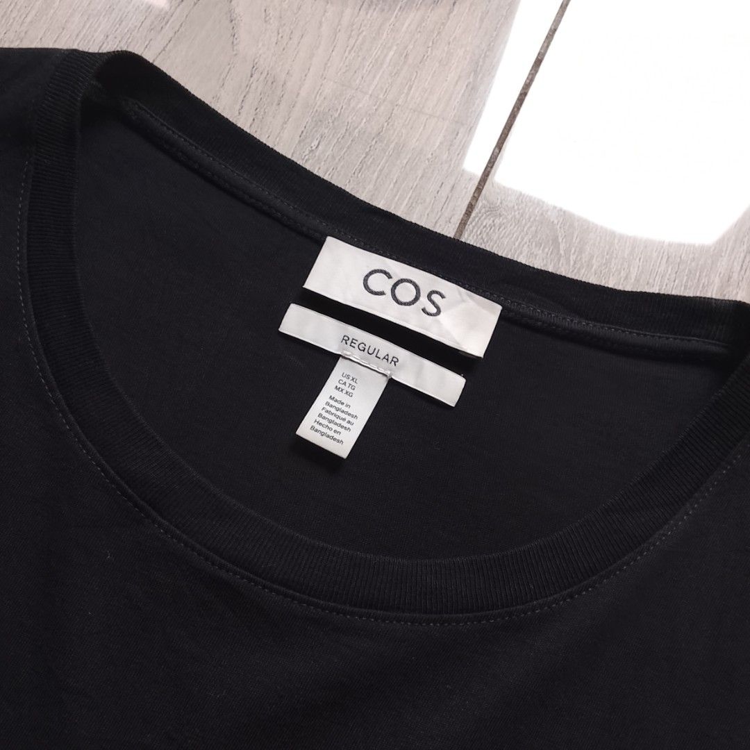 COS - Essential Plain Black Shirt (Category: Luxury Apparel) located in Angeles City. Submitted by sselects_ (Listing ID 1468515145, Image 2). Description: Details of the item: *Color may vary due to lighting Size: XL on tag Width: 22" Length: 27" Issue: small hole as seen on pic, NEEDS WASH Condition: Excellent ALL ITEMS ARE NEGOTIABLE.