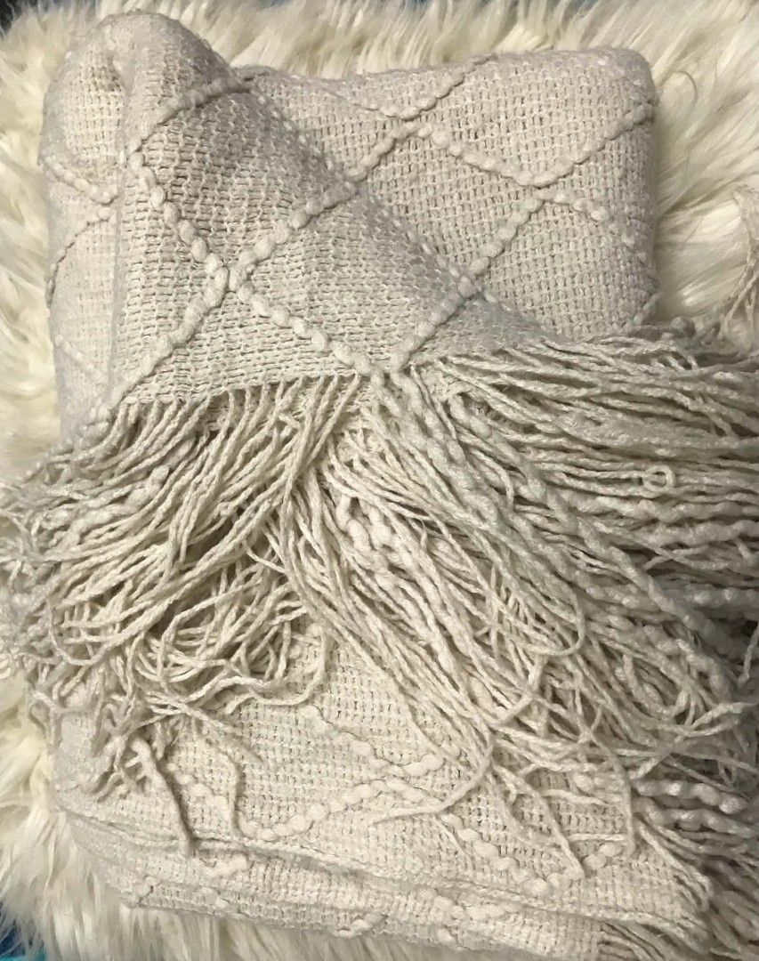Cream Boho Knitted Throw Blanket with Fringe (Category: Other Home Decor) located in Imus. Submitted by stop_shop7 (Listing ID 1468553074, Image 1). Description: - Colour: Cream - Material: Soft textured knit - Design: Diamond tufted pattern with long fringe trim on both ends - Usage: Perfect for draping over a sofa or bed - Style: Neutral tone that matches most home decors -Need wash.
