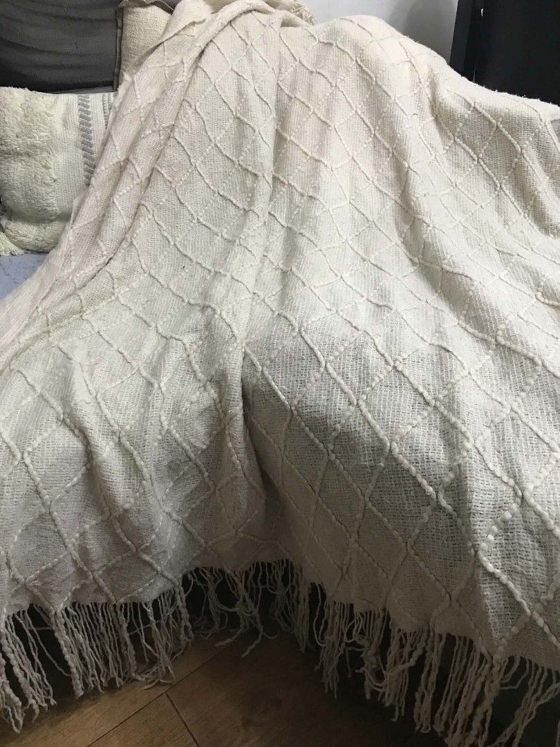 Cream Boho Knitted Throw Blanket with Fringe (Category: Other Home Decor) located in Imus. Submitted by stop_shop7 (Listing ID 1468553074, Image 3). Description: - Colour: Cream - Material: Soft textured knit - Design: Diamond tufted pattern with long fringe trim on both ends - Usage: Perfect for draping over a sofa or bed - Style: Neutral tone that matches most home decors -Need wash.