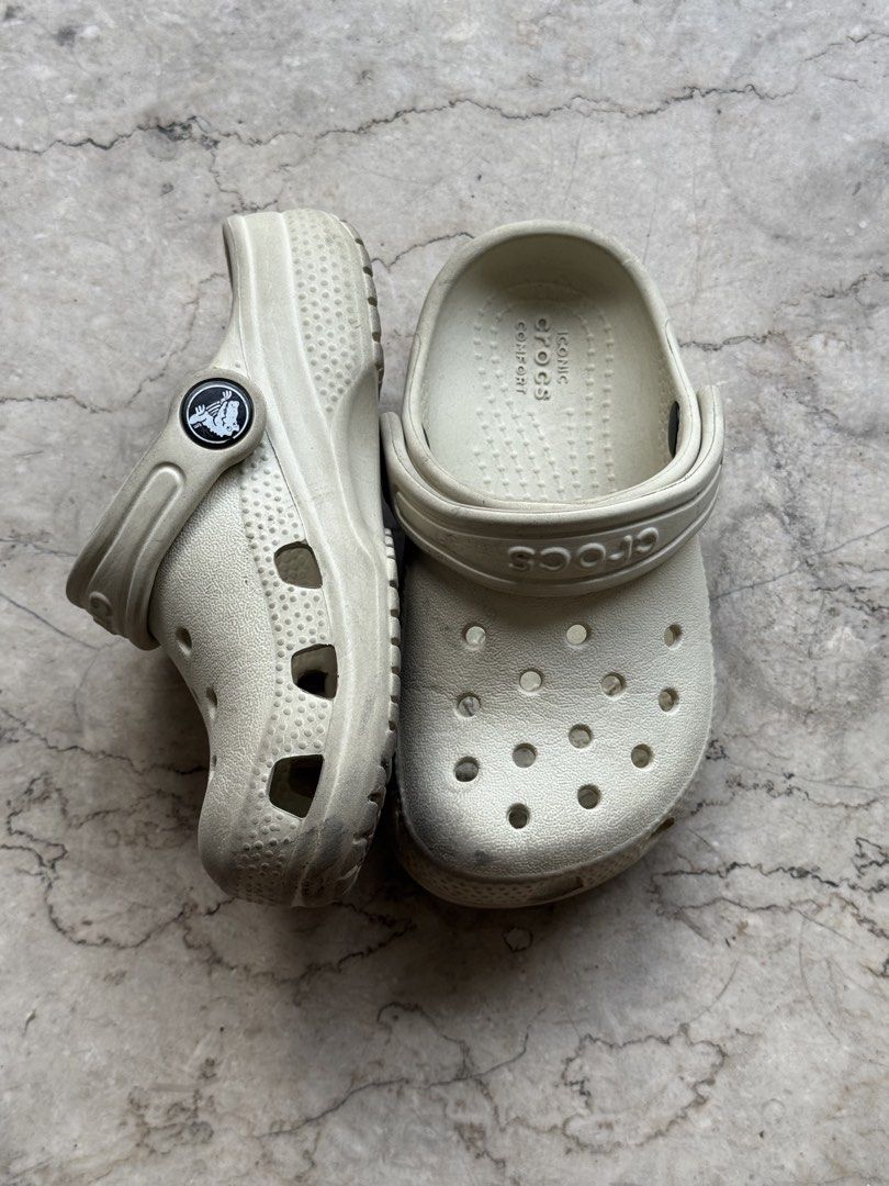Crocs Classic Clog Bone Off-White Size C8 (Category: Babies & Kids Fashion) located in Quezon City. Submitted by pamyeloo (Listing ID 1468558148, Image 2). Description: - Color: Bone off-white - Size: C8 (stamped on bottom) - Style: Classic kids' slip-on clogs with secure heel strap - Features: Iconic comfort design with ventilation holes - Condition: Soles show dirt and wear from outdoor use.
