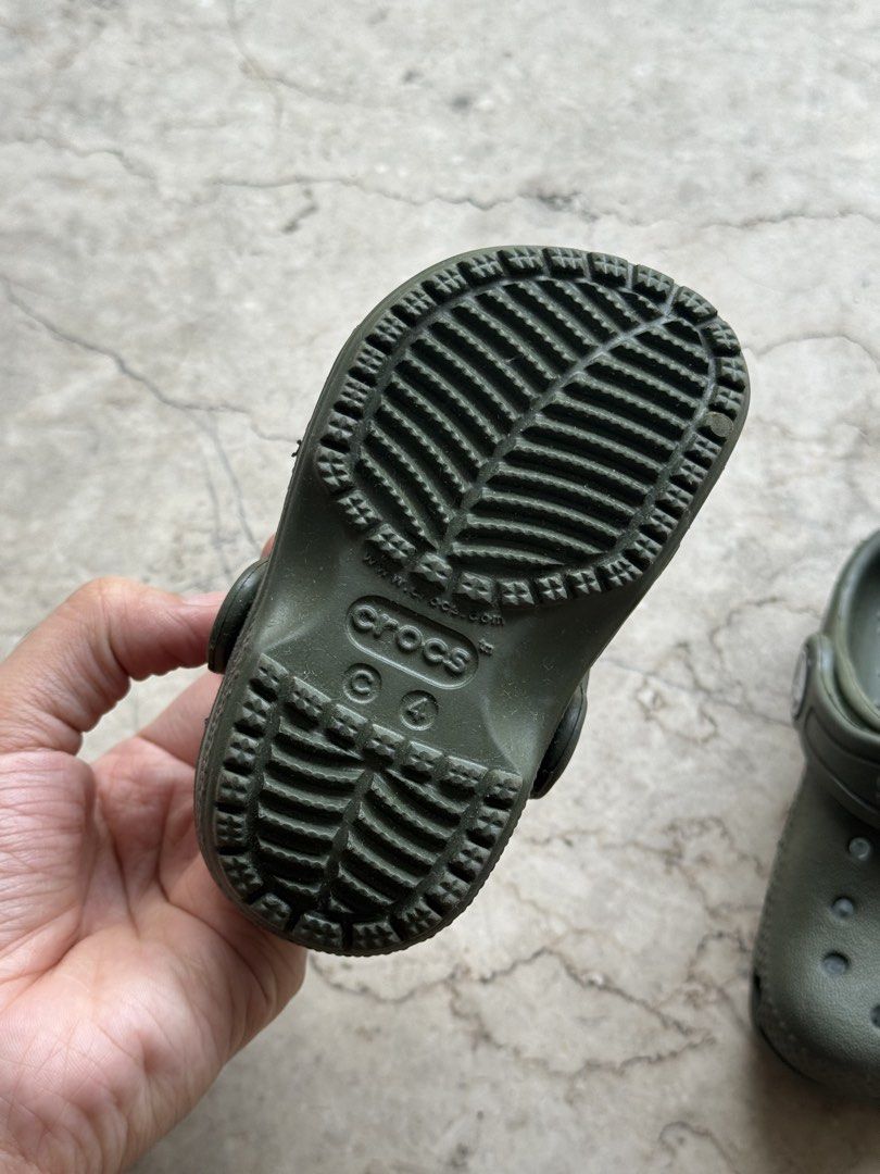Crocs Olive Green Size C4 (Category: Babies & Kids Fashion) located in Quezon City. Submitted by pamyeloo (Listing ID 1468557792, Image 3). Description: - Color: Olive Green - Size: C4 (stamped on sole) - Style: Classic slip-on with ventilation holes - Comfort: Iconic comfort footbed - Fit: Secure heel strap - Condition: Minimal wear on treads, great everyday condition.