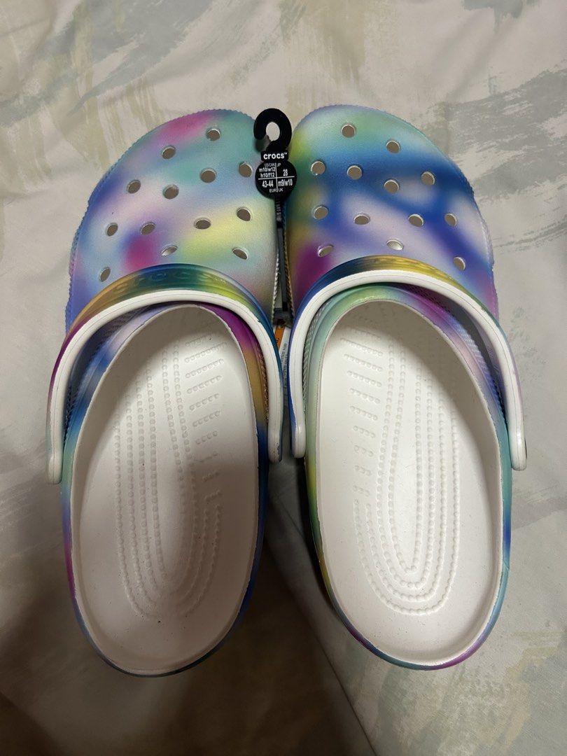 Crocs Tie Dye Clog Sandals (Category: Sandals) located in Manila. Submitted by ellajane_0508 (Listing ID 1468597139, Image 2). Description: - Brand new with original store tags attached - Fun, eye-catching multi-color tie-dye patterns - Iconic lightweight comfort for all-day wear - Ventilation ports add breathability and shed water - Pivoting heel straps for a more secure fit SIZE IS PROVIDED IN EACH PICTURE. PRICE IS NEGOTIABLE!!!!.