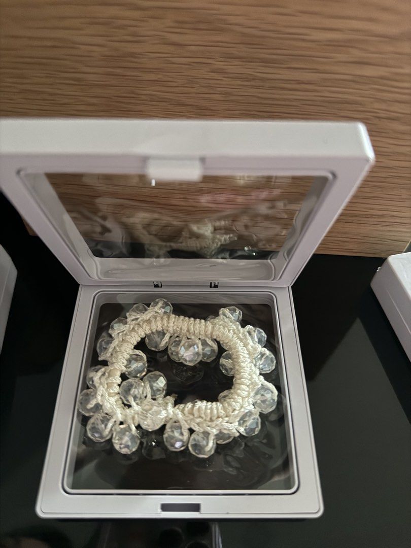 Crystal beaded hair tie elastic scrunchie (Category: Hair Accessories) located in Mandaluyong City. Submitted by declutteringmylife101 (Listing ID 1468570299, Image 3). Description: Sparkly beaded hair band that holds hair securely without tangling. -colors: Black, White, Pink, Maroon/purple Comes in a cute clear display box. Perfect for daily wear! -negotiable get all 4 for 300 pesos only.
