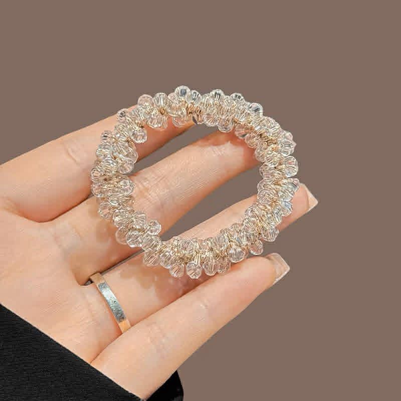 Crystal beaded hair tie elastic scrunchie (Category: Hair Accessories) located in Mandaluyong City. Submitted by declutteringmylife101 (Listing ID 1468570299, Image 2). Description: Sparkly beaded hair band that holds hair securely without tangling. -colors: Black, White, Pink, Maroon/purple Comes in a cute clear display box. Perfect for daily wear! -negotiable get all 4 for 300 pesos only.