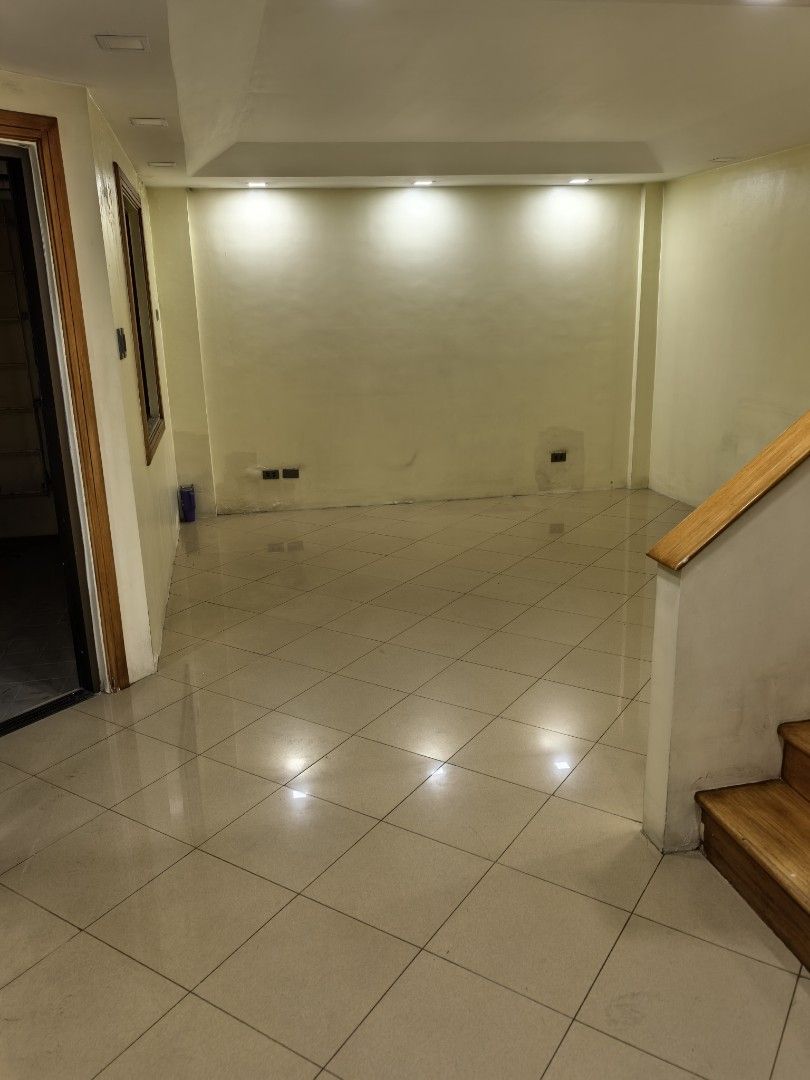 Cubao townhouse for rent (Category: Townhouse) located in Quezon City. Submitted by mwwmson (Listing ID 1468562831, Image 3). Description: - Multi-storey townhouse available for rent - Ready for occupancy with neutral painted walls - Ground floor covered carport - Panasonic inverter air conditioning units included - Ceramic tiled floors and elegant wooden staircase railings - Drop ceilings with modern recessed lighting - Windows equipped with sec