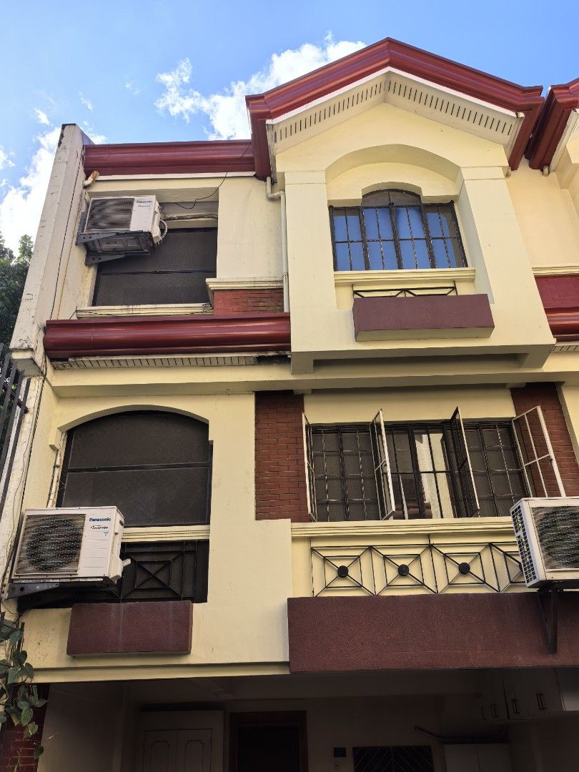 Cubao townhouse for rent (Category: Townhouse) located in Quezon City. Submitted by mwwmson (Listing ID 1468562831, Image 2). Description: - Multi-storey townhouse available for rent - Ready for occupancy with neutral painted walls - Ground floor covered carport - Panasonic inverter air conditioning units included - Ceramic tiled floors and elegant wooden staircase railings - Drop ceilings with modern recessed lighting - Windows equipped with sec