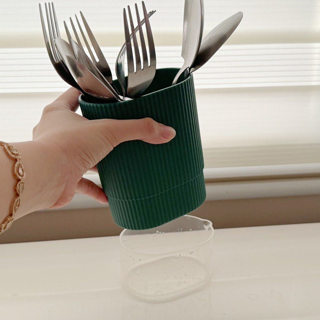 Cutlery Holder with Drain Drainer (Category: Food Organization & Storage) located in Marikina City. Submitted by lovegoeson (Listing ID 1468543255, Image 2). Description: - Color: Dark Green - Design: Stylish ribbed texture with a simple, clean look - Feature: Clear detachable base easily catches and removes water drips - Capacity: Holds plenty of forks, spoons, and kitchen utensils - Benefit: Keeps your countertops dry, organized, and clutter-fr