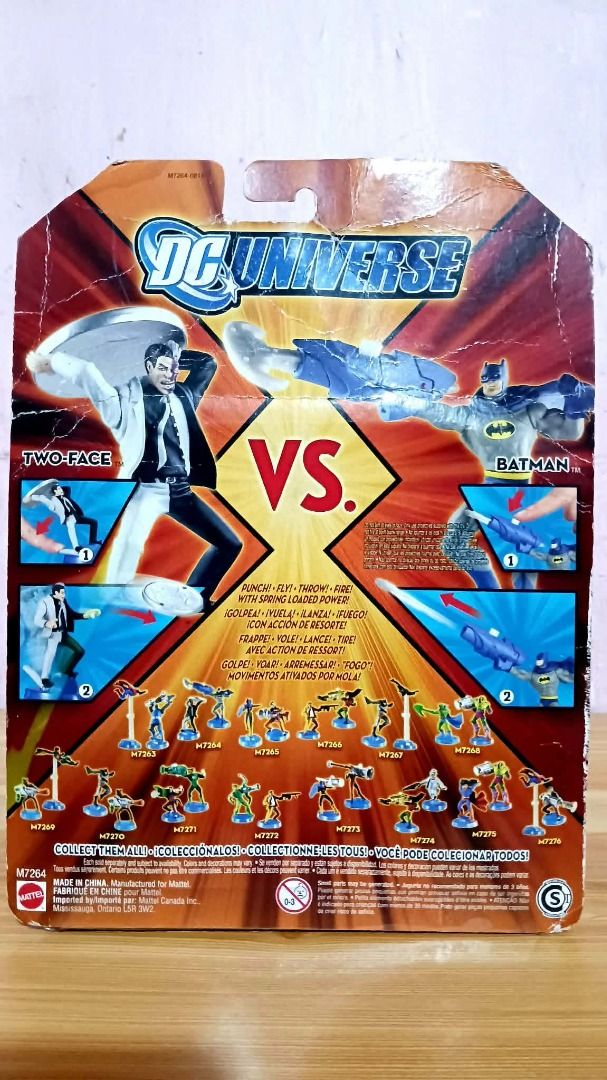 DC Universe Two-Face vs Batman (Category: Vintage Collectibles) located in Manila. Submitted by mickey_salonga (Listing ID 1468605951, Image 2). Description: - Brand: Mattel DC Universe - Item: Batman & Two-Face Action Figure Twin Pack - Features: Spring-loaded power features (Two-Face coin disk thrower, Batman projectile launcher) - Condition: Brand new, unopened packaging with minor shelf wear on the cardboard backing - Ideal for: DC Comics and