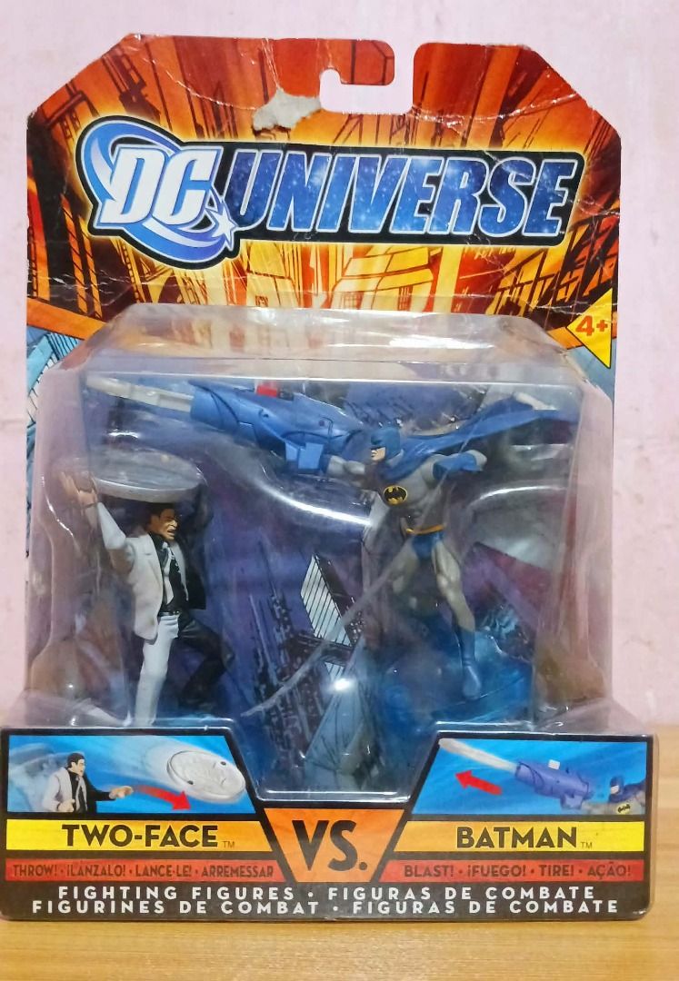 DC Universe Two-Face vs Batman (Category: Vintage Collectibles) located in Manila. Submitted by mickey_salonga (Listing ID 1468605951, Image 1). Description: - Brand: Mattel DC Universe - Item: Batman & Two-Face Action Figure Twin Pack - Features: Spring-loaded power features (Two-Face coin disk thrower, Batman projectile launcher) - Condition: Brand new, unopened packaging with minor shelf wear on the cardboard backing - Ideal for: DC Comics and