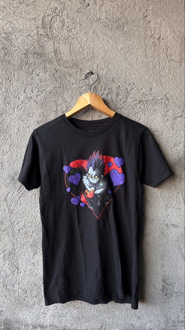 Death Note Ryuk Hearts T-Shirt Ripple Junction Black Medium (Category: Tshirts & Polo Shirts ) located in Cabuyao City. Submitted by bulandos (Listing ID 1468710285, Image 1). Description: - Official Death Note merchandise by Ripple Junction & Viz Media - Features Ryuk surrounded by red and purple hearts - Size: Medium - Material: 100% comfortable cotton - Fit: Standard short sleeve crewneck - Condition: Clean print with a stylish distressed text