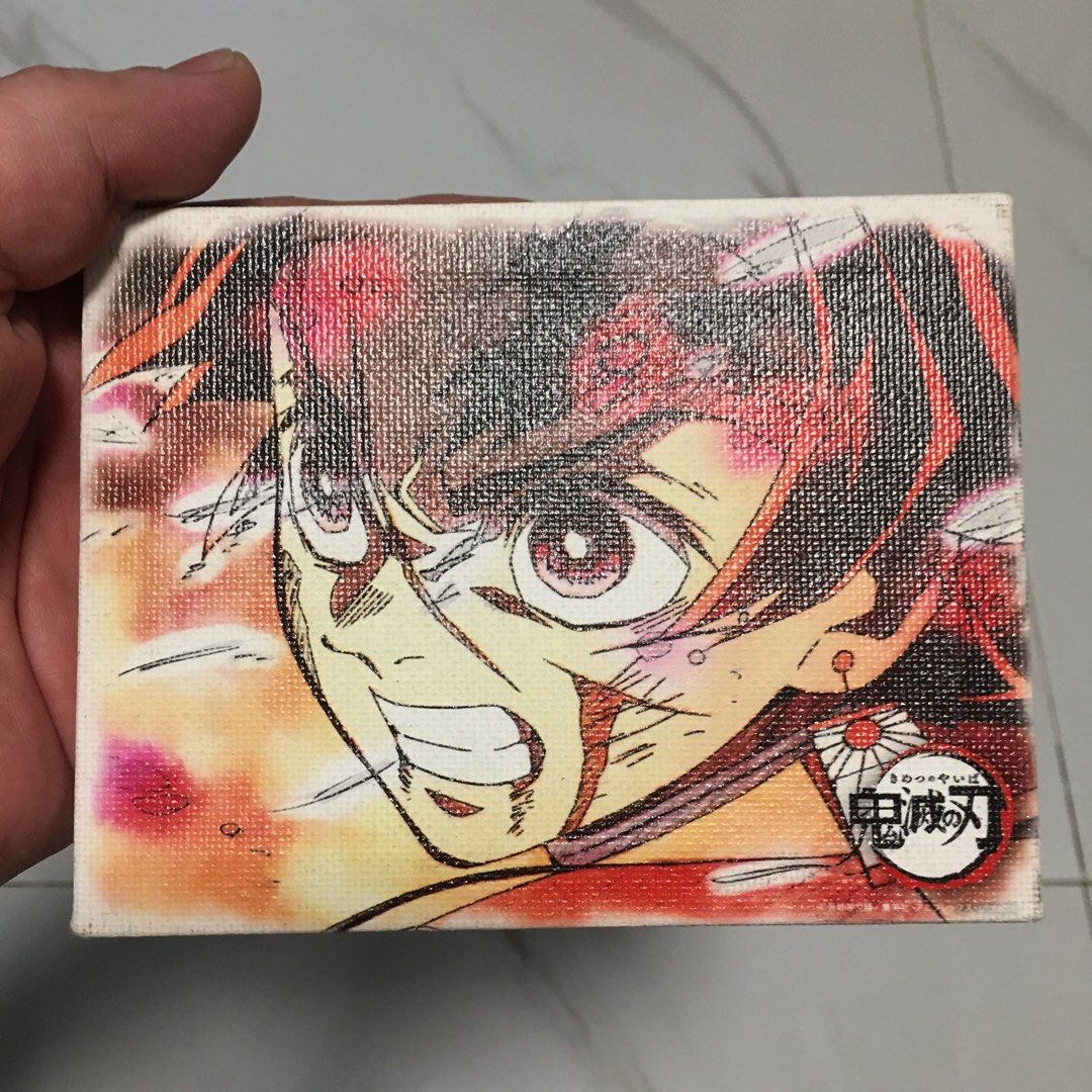 Demon Slayer Tanjiro Mini Stretched Canvas Art (Category: Art & Prints) located in Pasay City. Submitted by gilbertso62551 (Listing ID 1468565176, Image 2). Description: - Character: Tanjiro Kamado from Demon Slayer - Material: Stretched canvas over a sturdy wooden frame - Design: Vibrant anime artwork with signature corner logo - Size: Compact and lightweight - Display: Easy to prop up on a desk or hang on a wall - Ideal for: Anime fans and coll