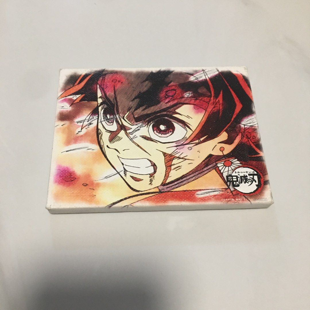 Demon Slayer Tanjiro Mini Stretched Canvas Art (Category: Art & Prints) located in Pasay City. Submitted by gilbertso62551 (Listing ID 1468565176, Image 1). Description: - Character: Tanjiro Kamado from Demon Slayer - Material: Stretched canvas over a sturdy wooden frame - Design: Vibrant anime artwork with signature corner logo - Size: Compact and lightweight - Display: Easy to prop up on a desk or hang on a wall - Ideal for: Anime fans and coll