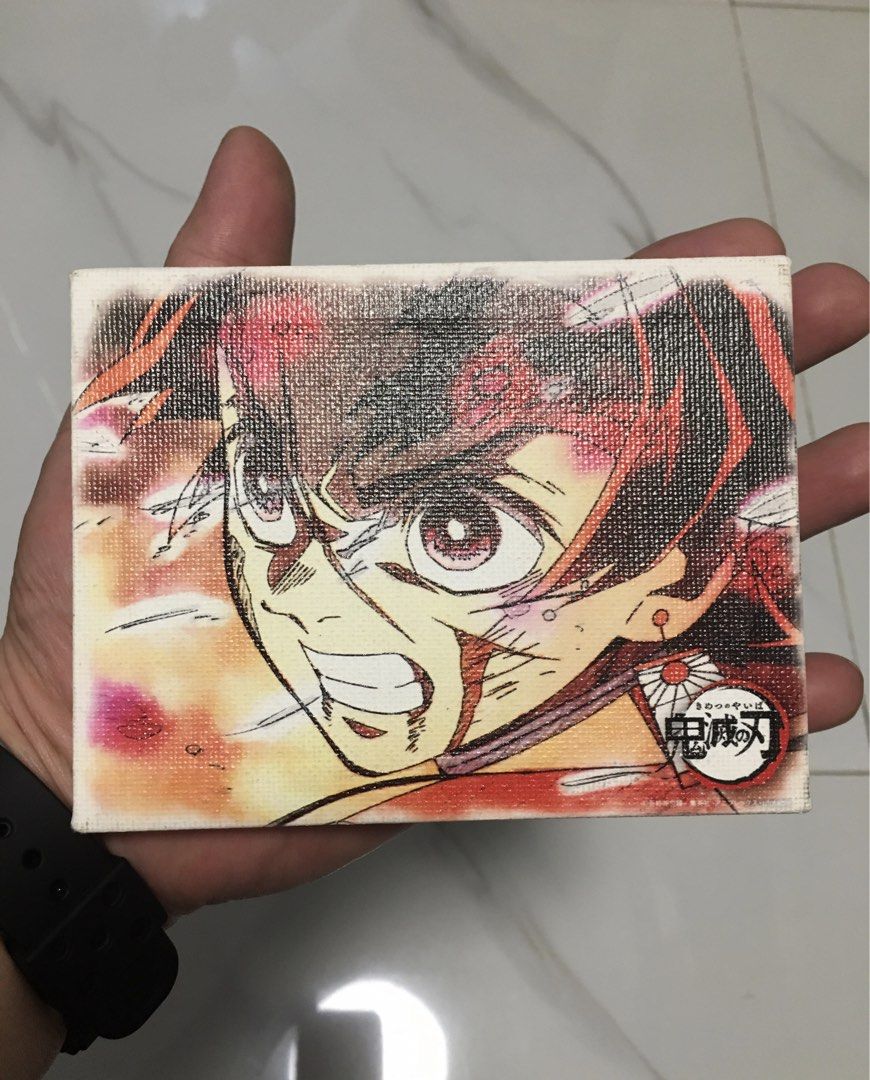 Demon Slayer Tanjiro Mini Stretched Canvas Art (Category: Art & Prints) located in Pasay City. Submitted by gilbertso62551 (Listing ID 1468565176, Image 3). Description: - Character: Tanjiro Kamado from Demon Slayer - Material: Stretched canvas over a sturdy wooden frame - Design: Vibrant anime artwork with signature corner logo - Size: Compact and lightweight - Display: Easy to prop up on a desk or hang on a wall - Ideal for: Anime fans and coll