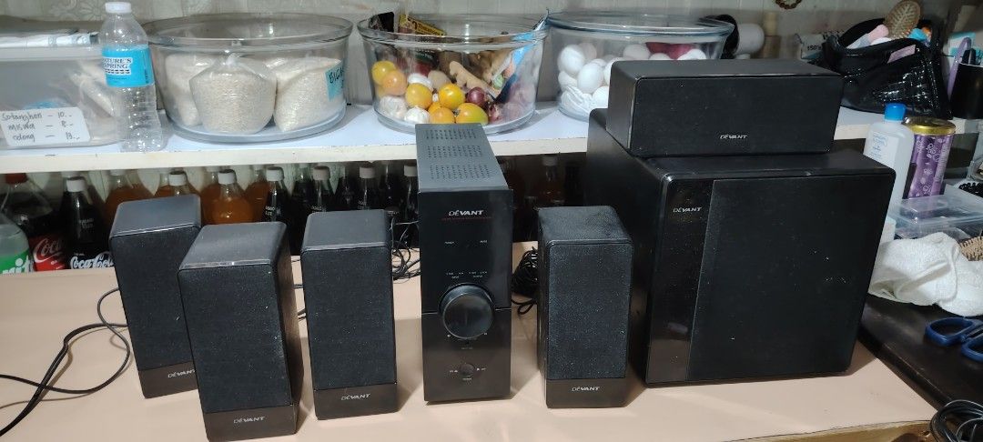Devant Home Theater Surround Sound Speaker System (Category: Soundbars, Speakers & Amplifiers) located in Manila. Submitted by nikiminmin19779 (Listing ID 1468504462, Image 1). Description: - Complete Devant home theater speaker system (subwoofer, center channel, and 4 satellite speakers) - Sleek black finish with front-facing volume dial and audio controls - Includes all attached wires and speaker cables, ready to connect - Delivers solid sound 