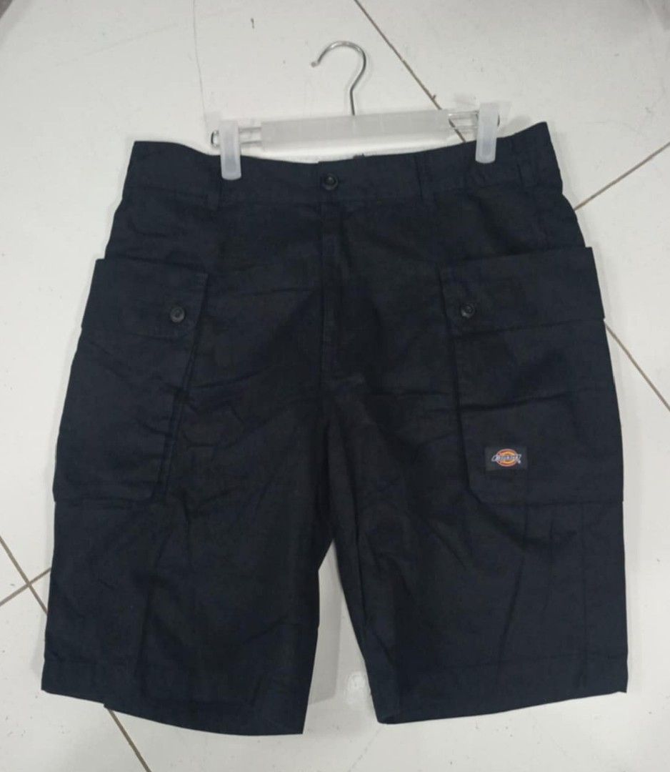 Dickies Black Cargo Shorts Size 32 (Category: Shorts) located in Caloocan City. Submitted by iandoom09 (Listing ID 1468605035, Image 1). Description: - Brand: Dickies - Color: Black - Size: 32 (175/80A) - Material: 100% cotton - Features: Utility pockets with button closures and signature Dickies logo patch - Style: Casual, ideal for outdoor activities or everyday wear - Care: Machine washable in cold water.