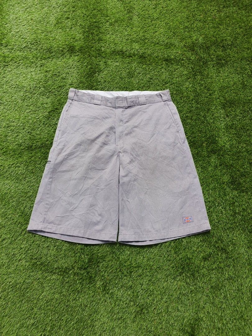 Dickies grey work shorts (Category: Shorts) located in Dipolog. Submitted by vinzz_thrift (Listing ID 1468600657, Image 1). Description: - Brand: Dickies - Color: Grey - Style: Flat front shorts with zip fly and sturdy belt loops - Details: Classic logo patches on the pocket and hem - Condition: Clean inside waistband lining, great for daily wear.
