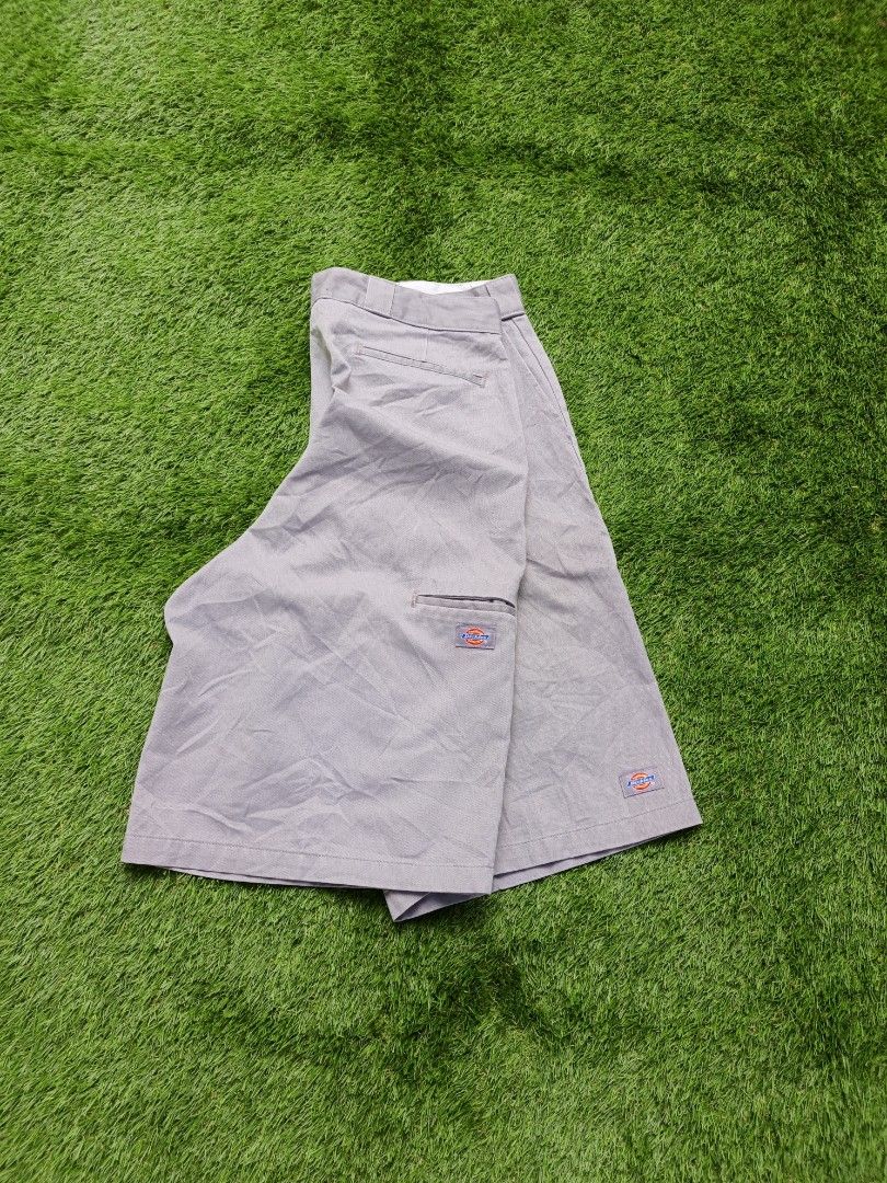 Dickies grey work shorts (Category: Shorts) located in Dipolog. Submitted by vinzz_thrift (Listing ID 1468600657, Image 2). Description: - Brand: Dickies - Color: Grey - Style: Flat front shorts with zip fly and sturdy belt loops - Details: Classic logo patches on the pocket and hem - Condition: Clean inside waistband lining, great for daily wear.