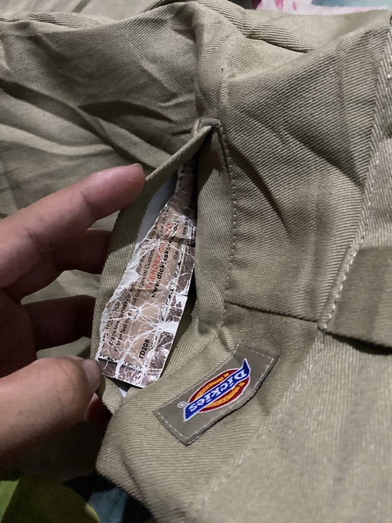 Dickies Khaki Work Pants (Category: Trousers) located in Manila. Submitted by zhu.finds (Listing ID 1468705669, Image 3). Description: - Brand: Dickies - Color: Khaki - Style: Classic straight leg work pants - Features: Belt loops, zip fly, signature back logo tag, white fabric-lined inner waistband - Material: Durable, heavy-duty twill - Condition: Excellent, ready to wear - Perfect for: Casual wear, workwear, or streetwear looks.