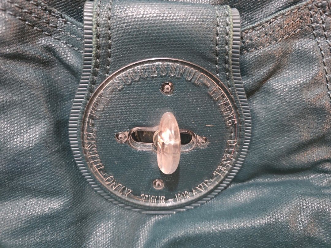Diesel Y2k hobo bag (Category: Shoulder Bags) located in Manila. Submitted by littleclosetfindsmnl (Listing ID 1468543871, Image 3). Description: Vintage Y2K Diesel Hobo Shoulder Bag 🩵 Teal/turquoise vintage Diesel bag with signature circular turn-lock detail. Shows signs of wear and minimal scratches on hardware which is normal. Open to reasonable offers! ✨ RFS:Decluttering.