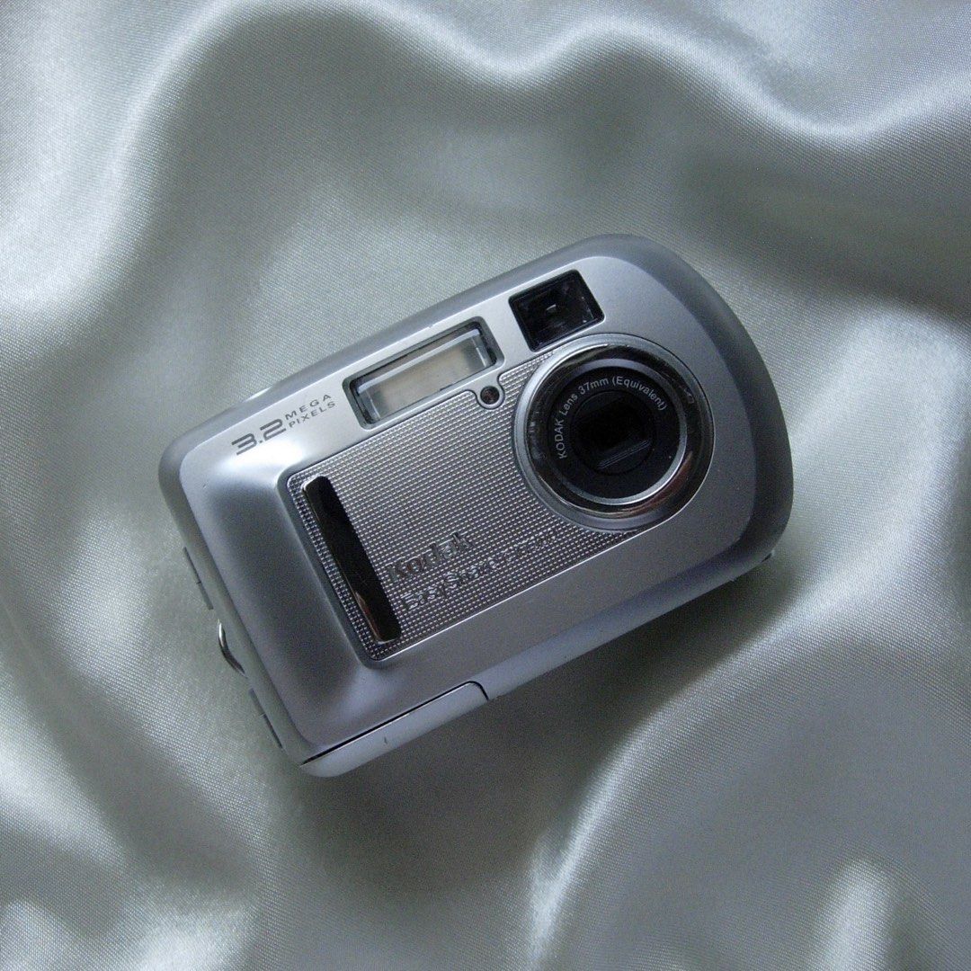 DIGICAM KODAK EASYSHARE CX7300 DIGITAL CAMERA (Category: Cameras) located in Manila. Submitted by la.memoriaph (Listing ID 1468555995, Image 1). Description: Body: 9/10 3.2MP | Released in March 2004 Uses SD Card & 2 pcs Double Battery TESTED: All posted photos are RAW FULLY FUNCTIONAL 📌 Battery door needs tape to fully close. WHAT’S ON THE BOX: • Unit • Memory Card • Pouch • Beaded Wrist Strap • Stickers Accepting RESERVATIONS/ LAYAWAY TERMS as