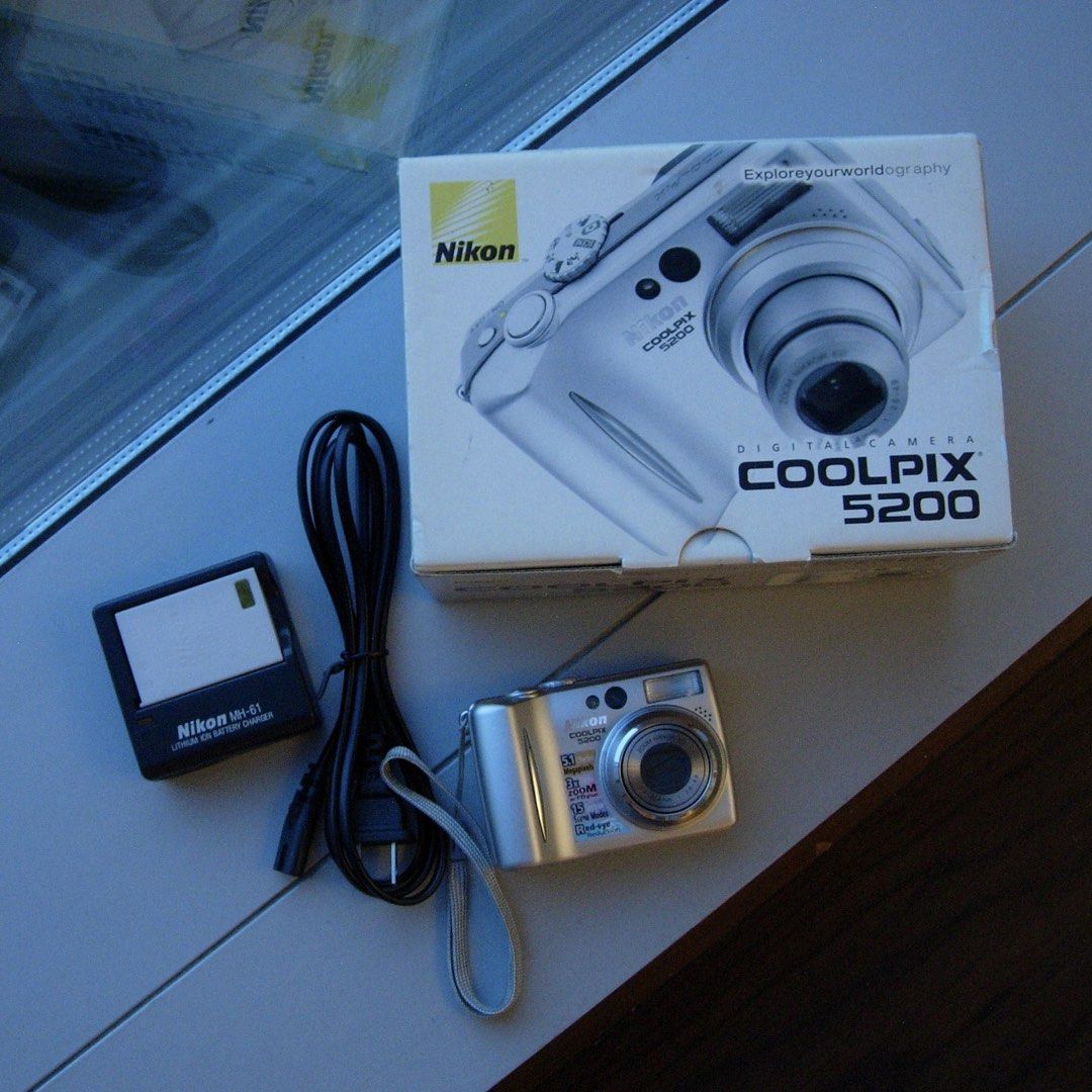 DIGICAM NIKON COOLPIX 5200 DIGITAL CAMERA (Category: Cameras) located in Manila. Submitted by la.memoriaph (Listing ID 1468559685, Image 1). Description: Body: 9/10 5.1MP | Released in February 2004 Uses SD Card & EN-EL5 Battery TESTED: All posted photos are RAW FULLY FUNCTIONAL NO ISSUE WHAT’S ON THE BOX: • Unit • Memory Card • Orig Charger • Battery • Pouch • Beaded Wrist Strap • Stickers Accepting RESERVATIONS/ LAYAWAY TERMS as long as can set