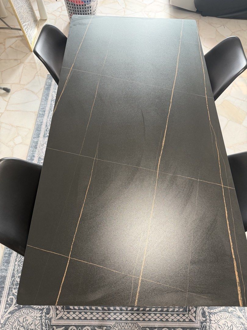 Dining Table (Category: Tables & Sets) located in Singapore. Submitted by kimikimirawraw (Listing ID 1468504375, Image 1). Description: Moving out sale Bought it for $1100, selling it at $600 (nego) Ceramic Dining Table + 4 Chairs for Sale Selling my ceramic dining table set, comes with 4 black dining chairs. Modern and elegant design with a black marble-style finish and gold veining. Perfect for family meals and everyday use. 📏 Dimensions: * Le
