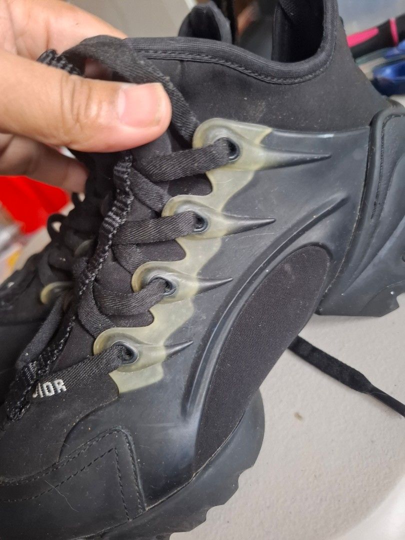 Dior Black High-Top Sneakers Size 35 (Category: Sneakers & Footwear) located in Marikina City. Submitted by bags21.ph (Listing ID 1468504129, Image 3). Description: - Authentic Black Dior high-top sneakers - Size: 35 (Made in Italy stamp on sole) - Unique lace-up design with clear rubber eyelet tabs - Trendy chunky rubber soles - Heel pull tab with embossed Dior branding on back - Condition: Regular wear on treads, overall well-maintained - Messa
