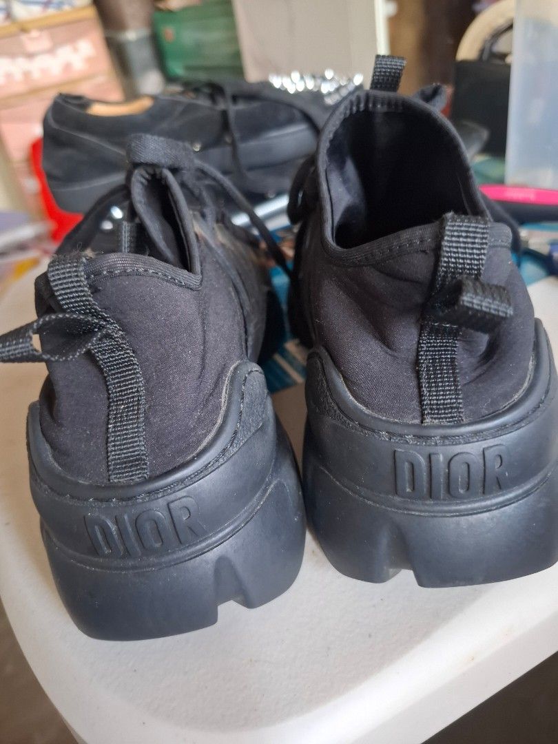 Dior Black Sneakers (Category: Sneakers) located in Marikina City. Submitted by bags21.ph (Listing ID 1468504434, Image 2). Description: - Brand: Dior - Color: Classic Black - Design: Chunky rubber sole with signature Dior branding on the heel and lace loop - Material: Breathable fabric upper with reinforced lace-up eyelets - Convenience: Pull tabs at the back for easy slip-on - Condition: Clean, everyday pair ready to wear - Location: Ships from