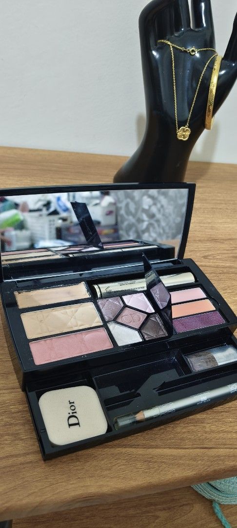 Dior Color Designer Makeup Palette Set (Category: Makeup) located in Manila. Submitted by truetree-3c99a8 (Listing ID 1468631867, Image 2). Description: - Brand: Dior Color Designer - Type: All-in-one multi-purpose makeup palette - Included items: Concealer, compact powder, blush, eyeshadows, lip gloss, mascara, eyeliner pencil, eyebrow pencil, applicators, mirror, and sponge - Packaging: Black case with silver logo lettering - Condition: Shows m