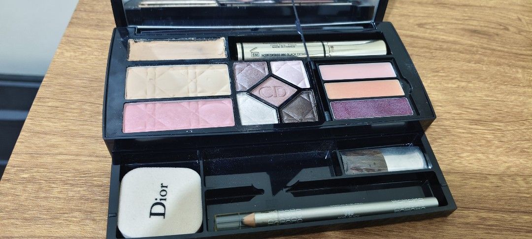 Dior Color Designer Makeup Palette Set (Category: Makeup) located in Manila. Submitted by truetree-3c99a8 (Listing ID 1468631867, Image 3). Description: - Brand: Dior Color Designer - Type: All-in-one multi-purpose makeup palette - Included items: Concealer, compact powder, blush, eyeshadows, lip gloss, mascara, eyeliner pencil, eyebrow pencil, applicators, mirror, and sponge - Packaging: Black case with silver logo lettering - Condition: Shows m