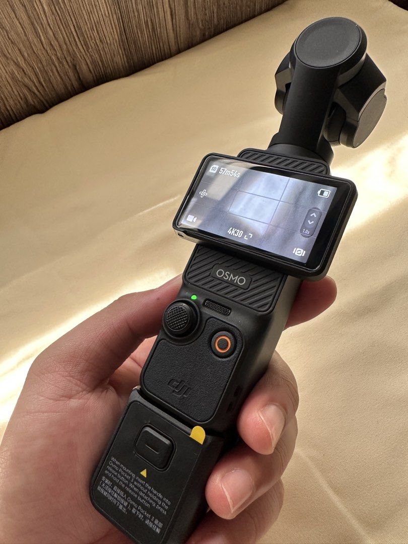 DJI Osmo Pocket 3 Gimbal Camera with Handle (Category: Video Cameras) located in Manila. Submitted by art2r (Listing ID 1468650528, Image 2). Description: - Model: DJI Osmo Pocket 3 - Condition: Clean and fully tested (buttons, gimbal, and touchscreen working normally) - Resolution: Compact 4K video setup for high-quality recording - Features: Rotatable touchscreen, easy one-handed operation - Inclusions: Protective case and extra handle attachme