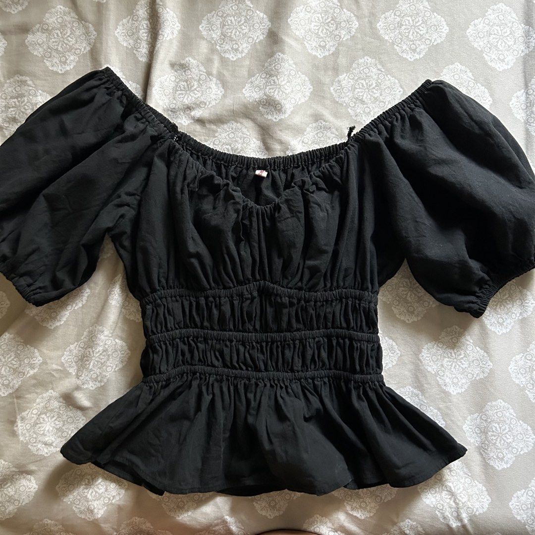 Dominique & Co. Jessica Top Black Plus Size (Category: Blouses) located in Marikina City. Submitted by ellies.mnl (Listing ID 1468522892, Image 2). Description: - Brand: Dominique & Co. - Style: Jessica Top (Black) - Neckline: Sweetheart with gathered bust detailing - Fit: Elasticated smocked waist with a flared peplum hem - Sleeves: Short puffy sleeves with elastic cuffs - Condition: Worn a few times, freshly washed, and properly stored - Materi