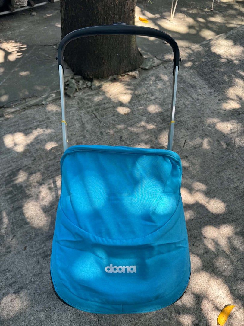 Doona+ Infant Car Seat and Stroller Turquoise (Category: Strollers) located in Rodriguez. Submitted by anjloving (Listing ID 1468552623, Image 3). Description: - Authentic Doona+ infant car seat and stroller in a stylish bright turquoise color - Seamlessly converts from a car seat to a stroller in seconds - Rear-facing design suitable for babies up to 13 kg - Built-in wheels fold right into the shell for ultimate convenience - Secure 5-point harn