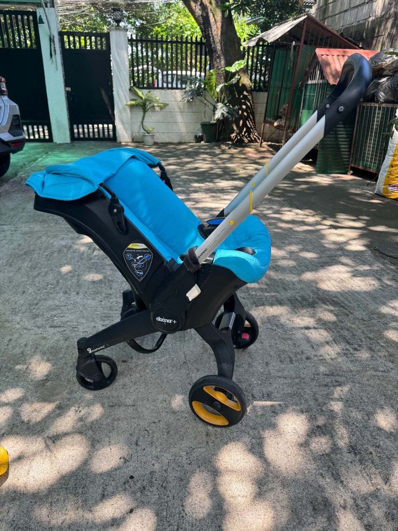 Doona+ Infant Car Seat and Stroller Turquoise (Category: Strollers) located in Rodriguez. Submitted by anjloving (Listing ID 1468552623, Image 1). Description: - Authentic Doona+ infant car seat and stroller in a stylish bright turquoise color - Seamlessly converts from a car seat to a stroller in seconds - Rear-facing design suitable for babies up to 13 kg - Built-in wheels fold right into the shell for ultimate convenience - Secure 5-point harn
