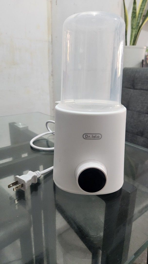 Dr. Isla Electric Baby Bottle Warmer (Category: Breastfeeding & Bottle Feeding) located in Bacoor. Submitted by jem60790 (Listing ID 1468526250, Image 1). Description: - Brand: Dr. Isla - Color: Clean White - Function: Electric bottle warmer - Features: Digital display dial, inner basket, and clear cover lid - Condition: Clean interior heating plate, ready for daily use - Inclusions: Main heating base with attached power cord Dr.Isla N22 Multi-Fu