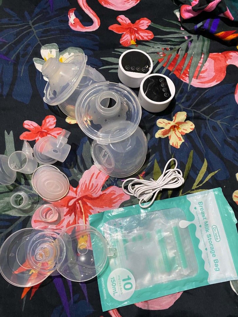 Dr. Isla Electric Breast Pump Model EB-26 (Category: Breastfeeding & Bottle Feeding) located in Caloocan City. Submitted by jjs.prelove (Listing ID 1468584738, Image 1). Description: - Brand/Model: Dr. Isla Electric Breast Pump EB-26 - Dual motor setup for efficient double pumping - Fully rechargeable with convenient top digital control buttons - Includes: 2 pump motors, silicone shields, tubing, and charging cable - Bonus: Comes with unopened, b