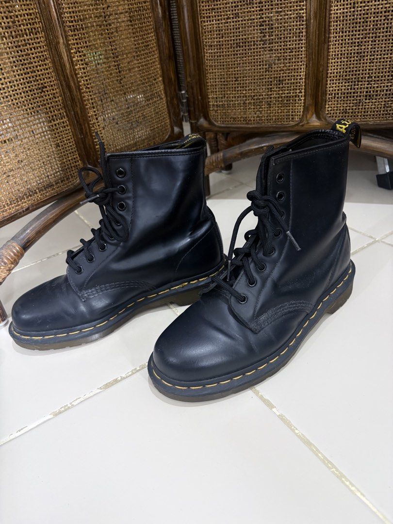 Dr. Martens 1460 Black Smooth Leather Boots (Category: Boots) located in Pasig City. Submitted by marias_wardrobe (Listing ID 1468506727, Image 1). Description: - Color/Material: Black smooth leather - Iconic Details: Classic yellow welt stitching and yellow heel loops - Closure: Lace-up with durable metal eyelets - Condition: Lightly worn with minimal toe creasing - Style: Versatile, timeless everyday footwear.