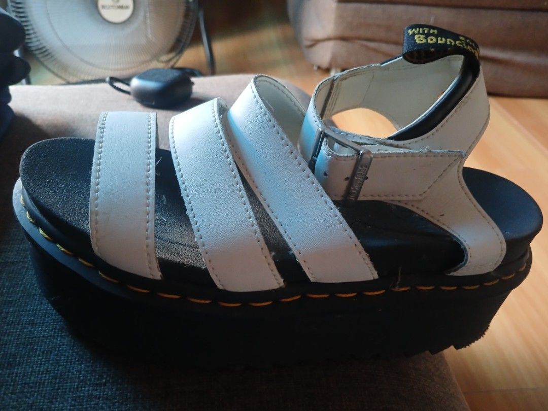 Dr. Martens White Platform Sandals (Category: Sandals) located in Iligan City. Submitted by sabaylestephanie0 (Listing ID 1468699373, Image 2). Description: - Brand: Dr. Martens - Style: Multi-strap platform sandals - Color: White with chunky black ribbed sole - Details: Signature yellow welt stitching and branded heel loop - Fit: Adjustable buckle strap for a secure fit - Comfort: Extra height with everyday wearability.