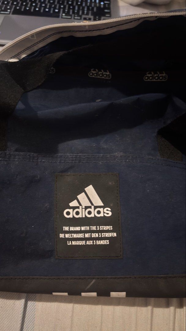 Duffle Bag in Navy Blue- Adidas (Category: Backpacks) located in Manila. Submitted by curatedbyiz (Listing ID 1468683031, Image 2). Description: -Adidas Navy Blue -Adjustable Strap -Gym/Travel Bag -Last Price -Payment Method: Gotyme/Gcash -Two side pockets (One with zipper) -Decluttering hence the low price -Location:Manila -No meetups strictly due to privacy reasons. - I will ONLY entertain questions about this listing if it's not included in th