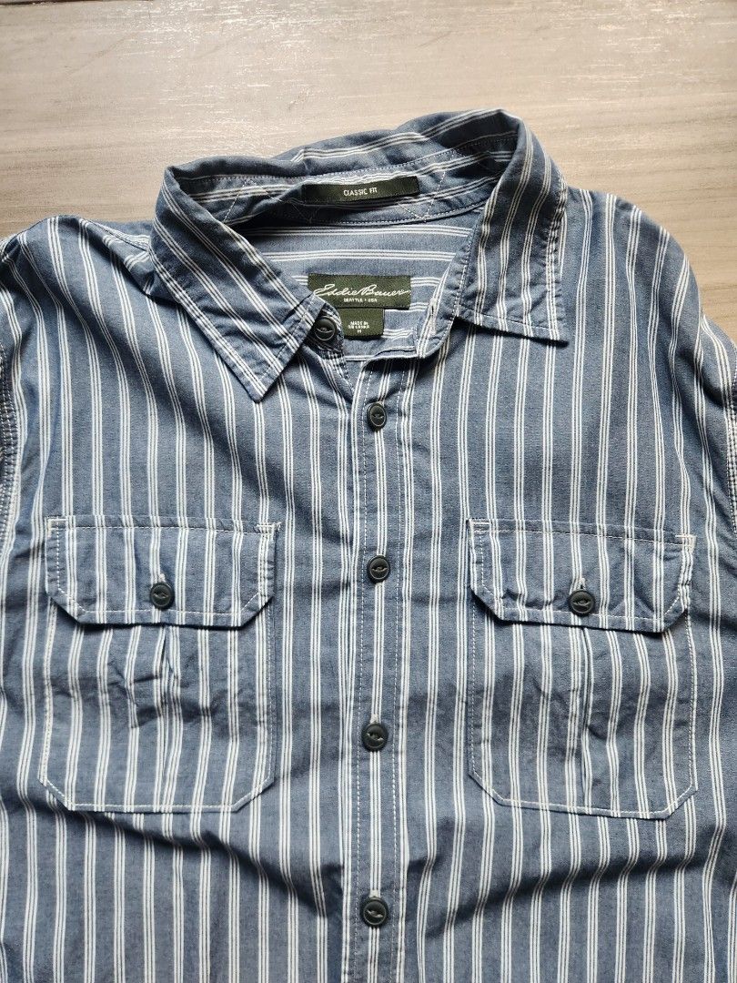 Eddie Bauer Oversized Shirt Jacket (Category: Tshirts & Polo Shirts ) located in Quezon City. Submitted by zero_two_seven (Listing ID 1468568974, Image 2). Description: - Brand: Eddie Bauer - Color: Bluish Gray - Size: M (Oversized) - 30 Front L 32 Back L x 22 W - Condition: 8/10 - Minimal Usage - Color may differ from the photos - Shipping fee is shouldered by the buyer.