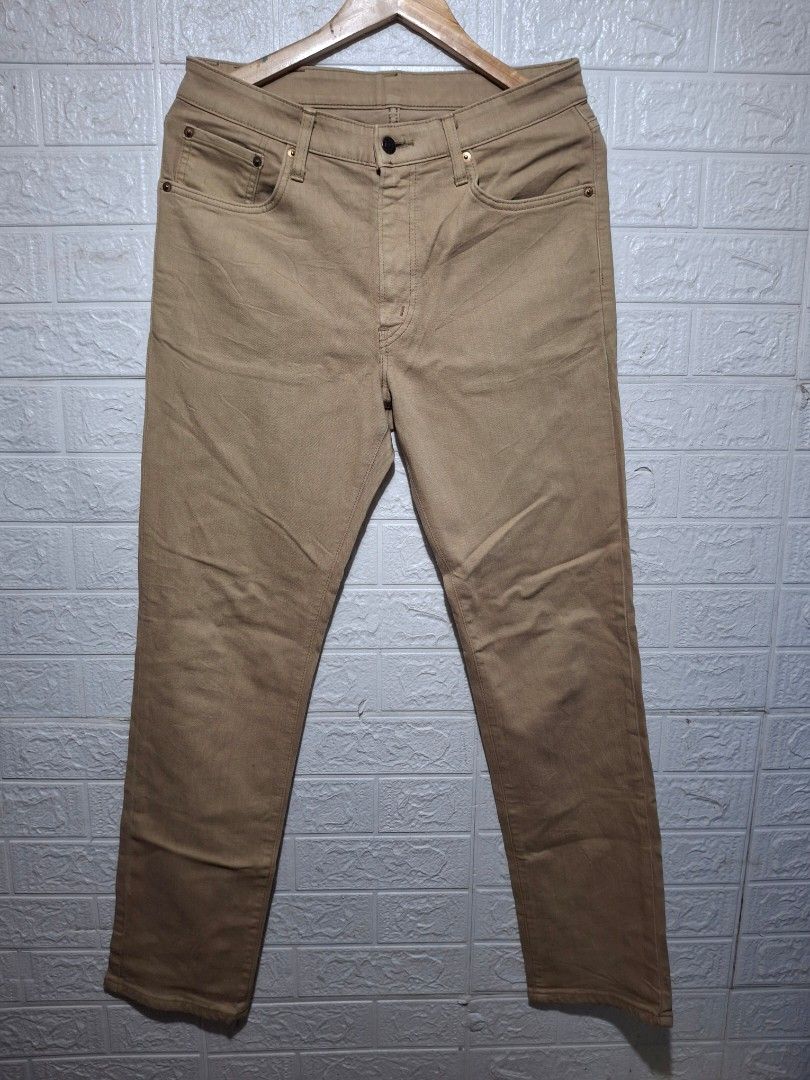 Edwin 503 Made in Japan Khaki Pants (Category: Trousers) located in Angeles City. Submitted by livemountain.e2ae07 (Listing ID 1468531651, Image 1). Description: - Authentic Edwin 503 khaki pants made in Japan - W15 L32.2 Hem 7 - Versatile tan twill fabric with button fly closure - Traditional 5-pocket styling with branded metal buttons and rivets - Features distinct black leather patch with silver embossed logo - Small woven logo tag on the righ