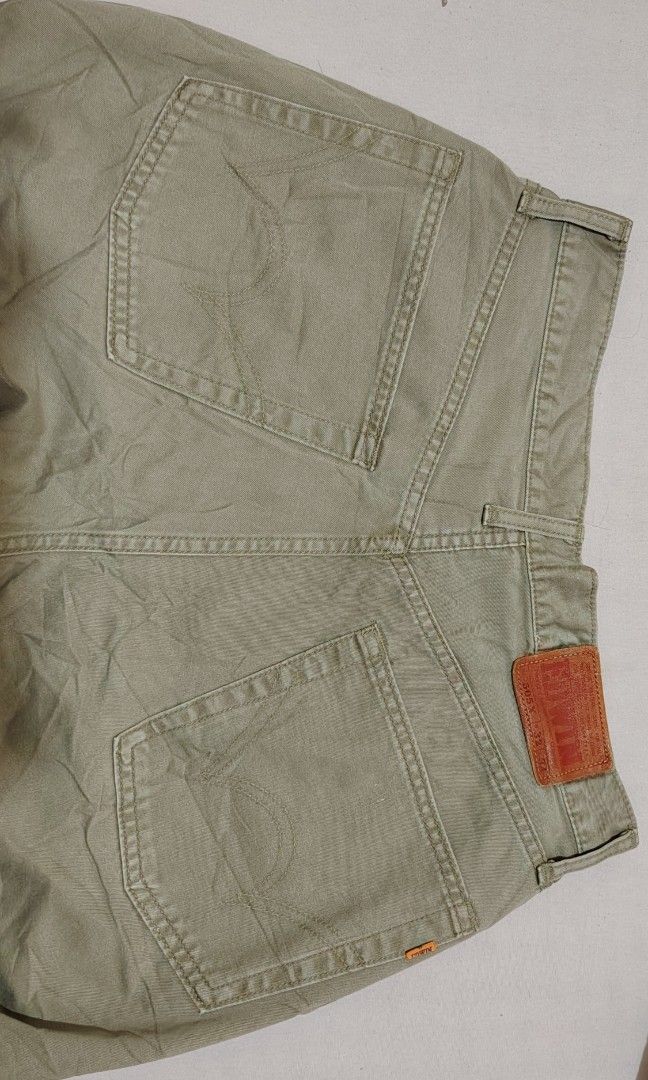 Edwin 5575 Olive Green Casual Pants (Category: Trousers) located in Manila. Submitted by forthriftstorewarriors (Listing ID 1468580017, Image 2). Description: - Brand/Model: Edwin 5575 pants - Color: Olive Green - Size: Tagged 32 x 34 - Actual Measurements: 30" waist, 41.5" length - Style Code: EKS-1851 - Details: Standard button fly and durable riveted pockets - Condition: Beautiful natural fading and creases from wear and washing.