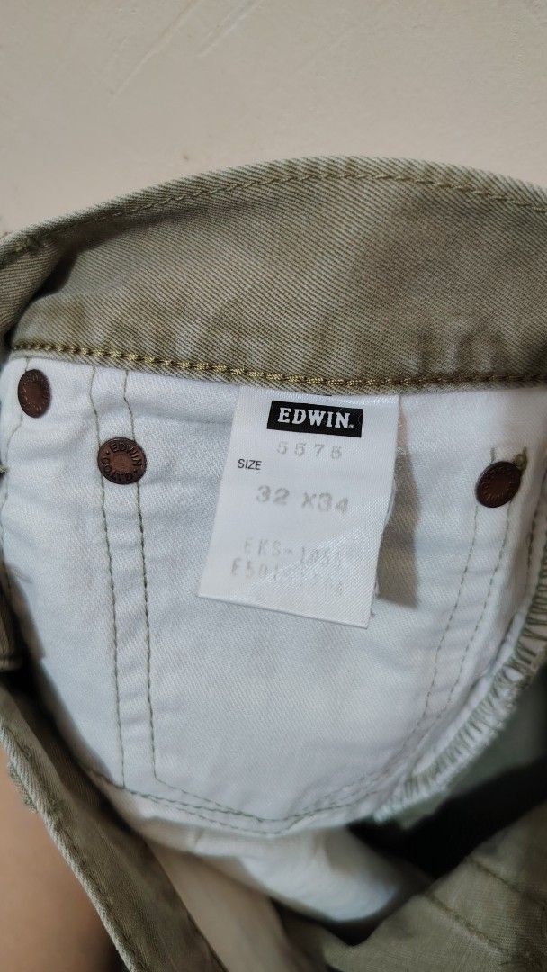 Edwin 5575 Olive Green Casual Pants (Category: Trousers) located in Manila. Submitted by forthriftstorewarriors (Listing ID 1468580017, Image 3). Description: - Brand/Model: Edwin 5575 pants - Color: Olive Green - Size: Tagged 32 x 34 - Actual Measurements: 30" waist, 41.5" length - Style Code: EKS-1851 - Details: Standard button fly and durable riveted pockets - Condition: Beautiful natural fading and creases from wear and washing.