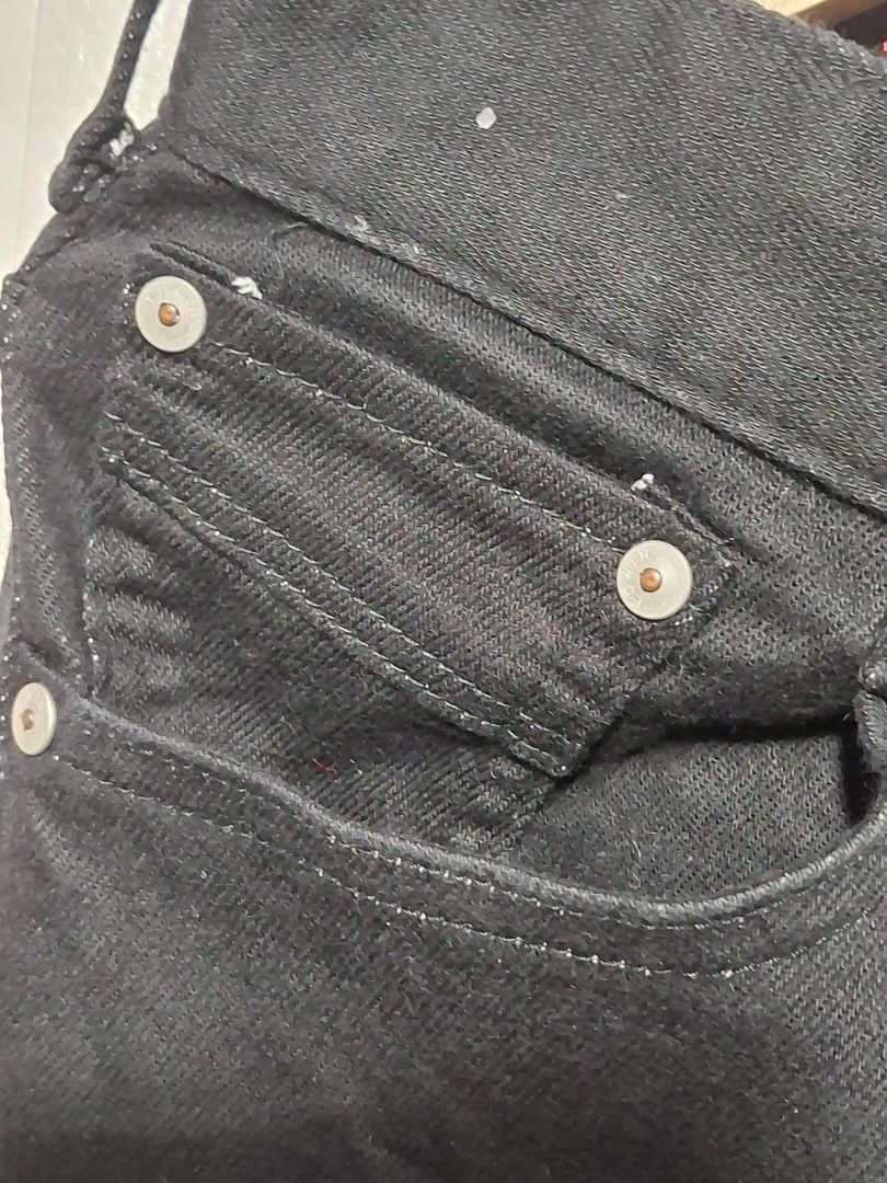 EDWIN Jerseys Black Denim Jeans (Category: Jeans) located in Angeles City. Submitted by livemountain.e2ae07 (Listing ID 1468569702, Image 3). Description: - Brand: EDWIN Jerseys - SIZE MEDIUM - W16.2 L42 HEM 8 - Color/Wash: Dark wash black denim with visible stretch weave texture - Style: Classic 5-pocket design - Hardware: Branded metal buttons and rivets - Details: Distinctive red interior waistband taping and embossed red leather back patch - 